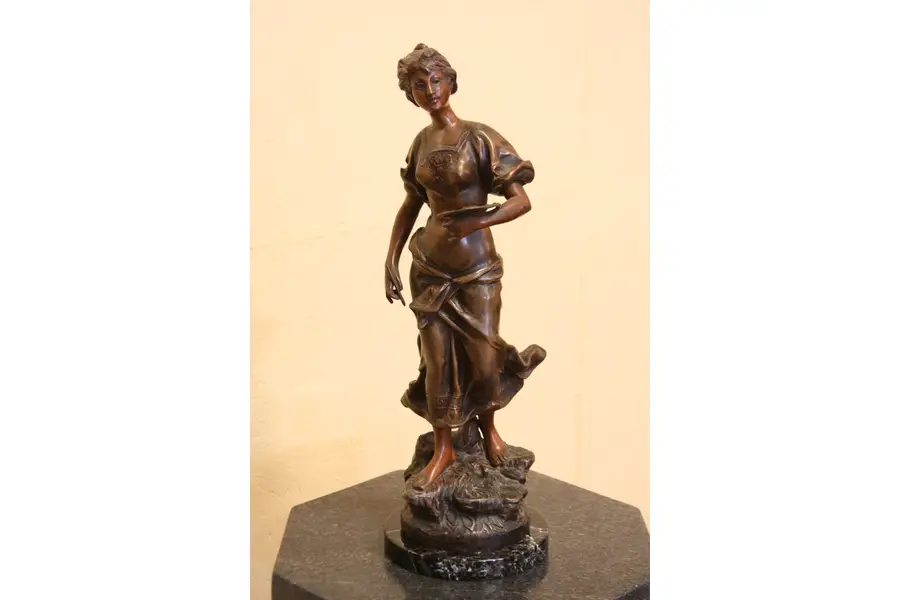 Photo of Art Nouveau Sculpture of a Woman with Palette