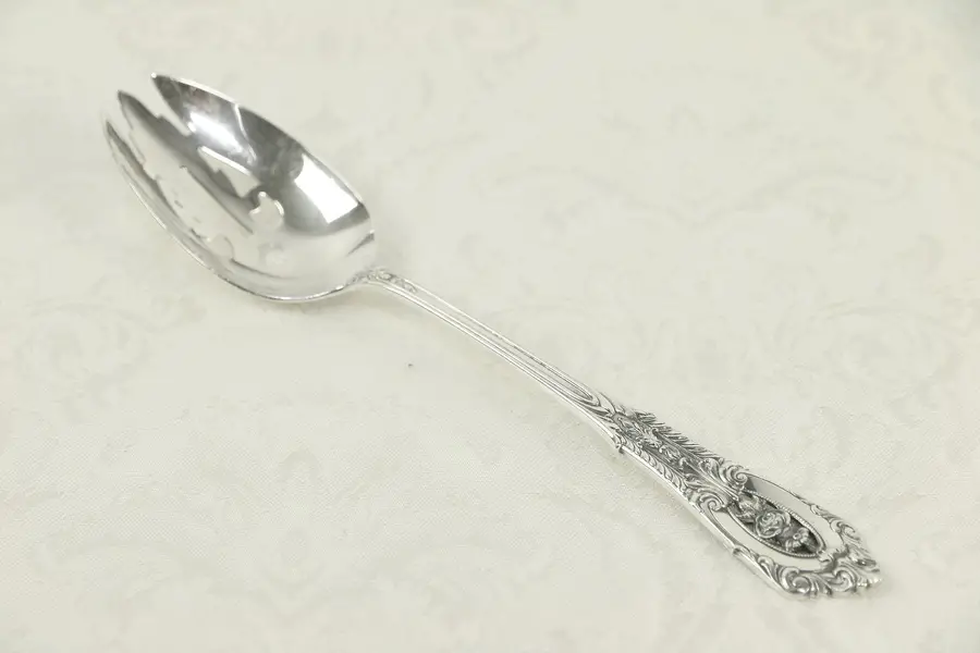 Photo of Sterling Silver Slotted 8 1/2" Serving Spoon, Rose Point by Wallace