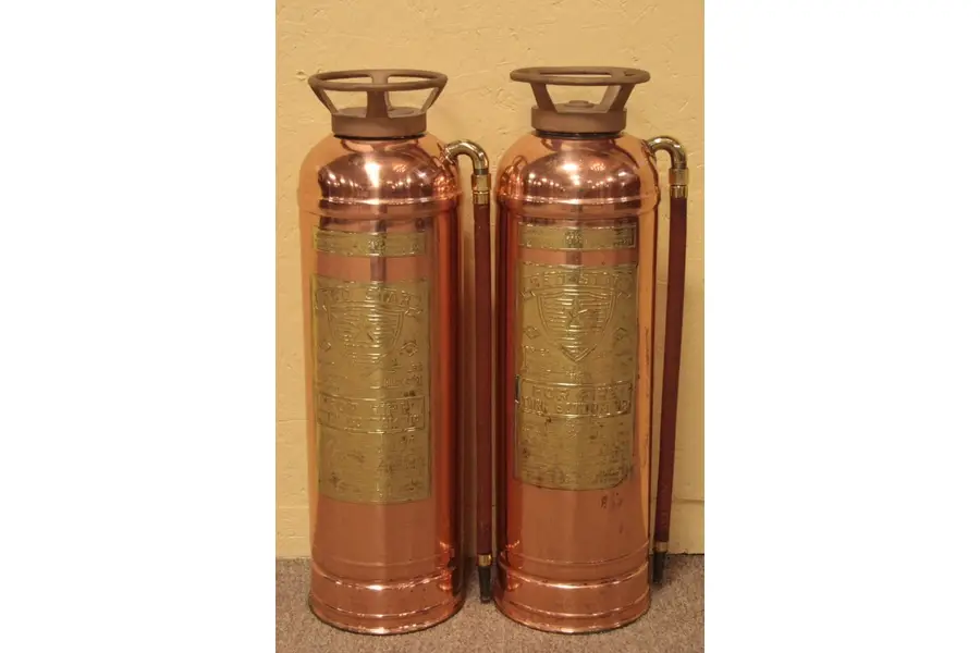 Photo of Pair Red Star Copper & Brass Fire Extinguishers