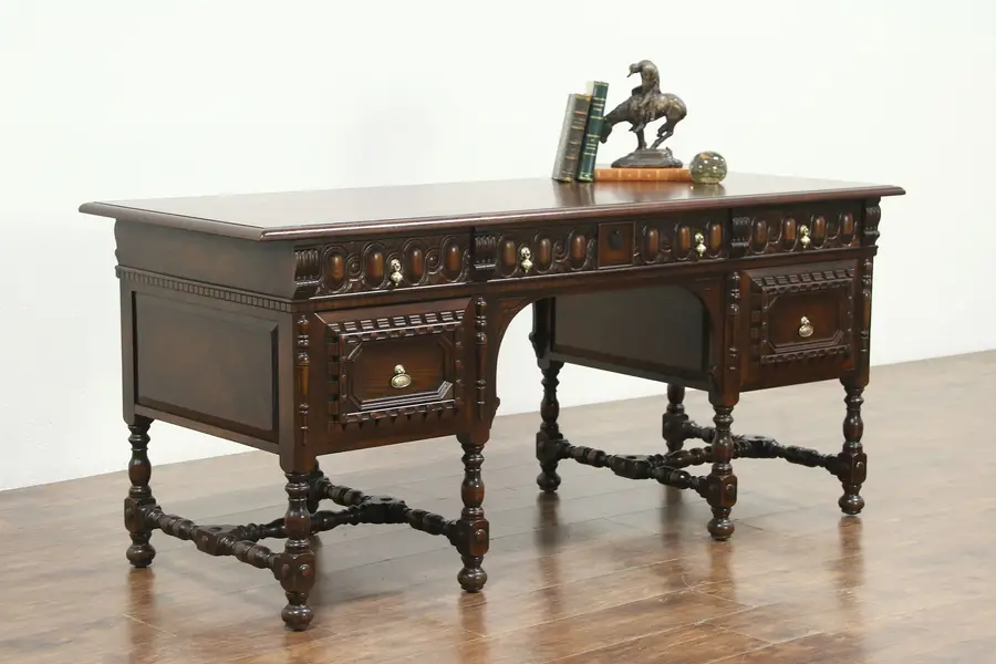 Photo of English Tudor Antique 1925 Carved Walnut Library Desk, signed Kittinger