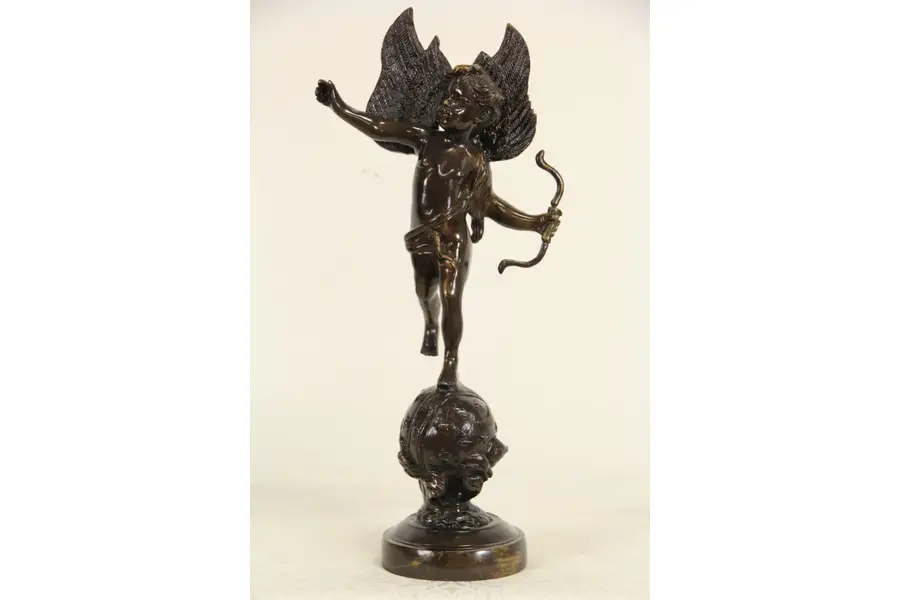 Photo of Cupid Angel Bronze Sculpture, Vintage Statue with Bow on Globe