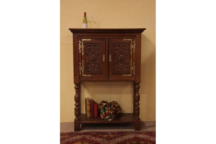 Photo of Hand Carved Oak Bar Cabinet with Bronze Hinges