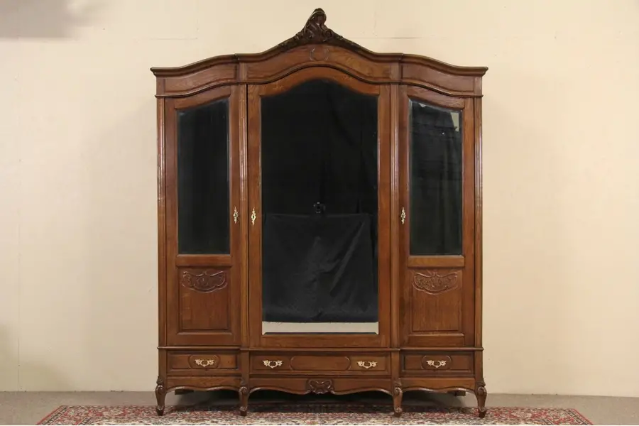 Photo of Country French Carved Oak 1900 Antique Triple Armoire, Beveled Mirror Doors