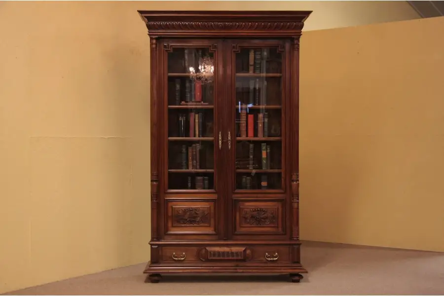 Photo of Carved Antique Bookcase with Musical Motifs