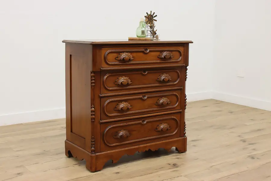 Photo of Victorian Carved Walnut Antique Four Drawer Dresser or Chest