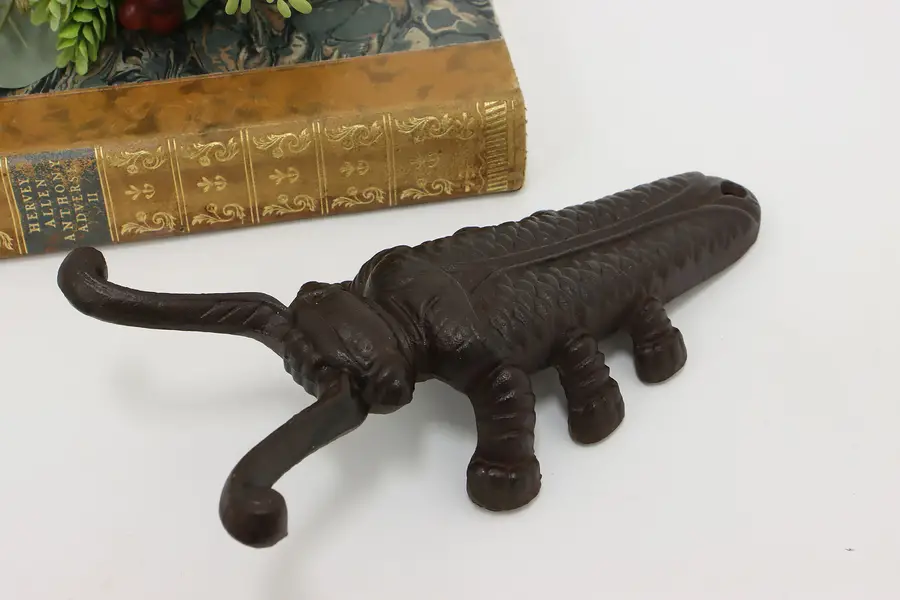 Photo of Farmhouse Antique Cast Iron Boot Jack Beetle Door Stop