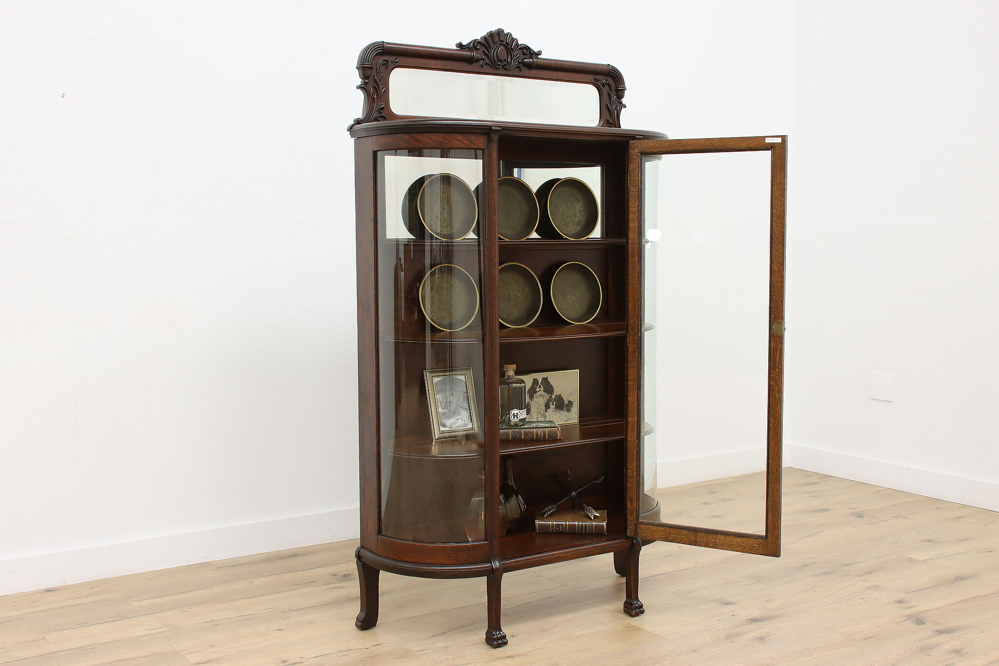 Antique curved glass china cabinet value discount